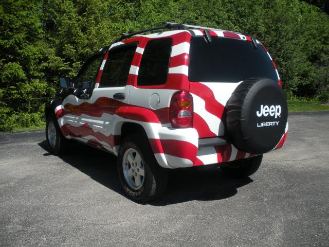 Driver rear corner of Flag Jeep from back 