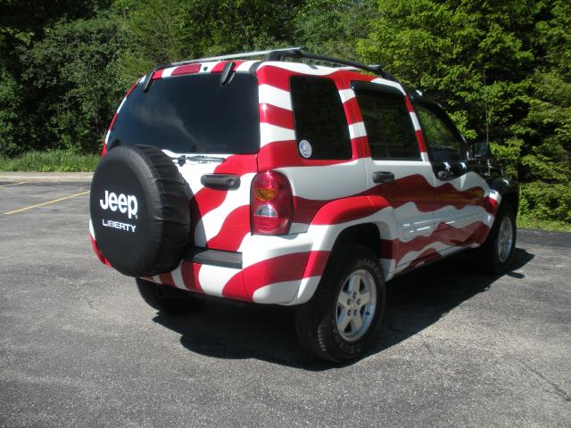 Passenger rear corner of Flag Jeep from rear