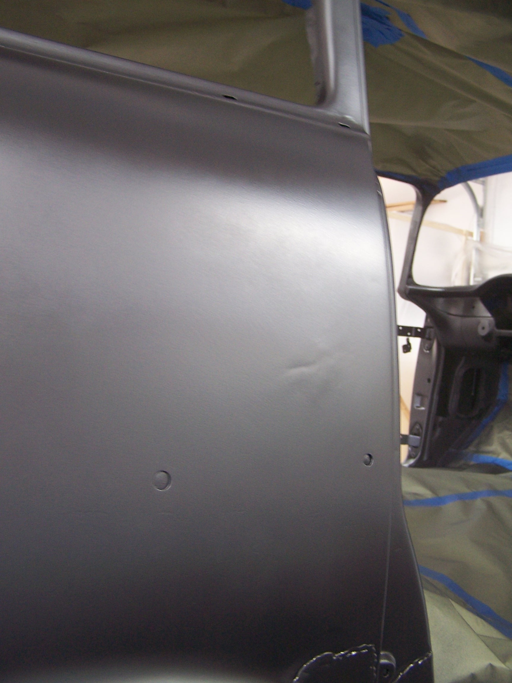 Crease in passenger rear fender