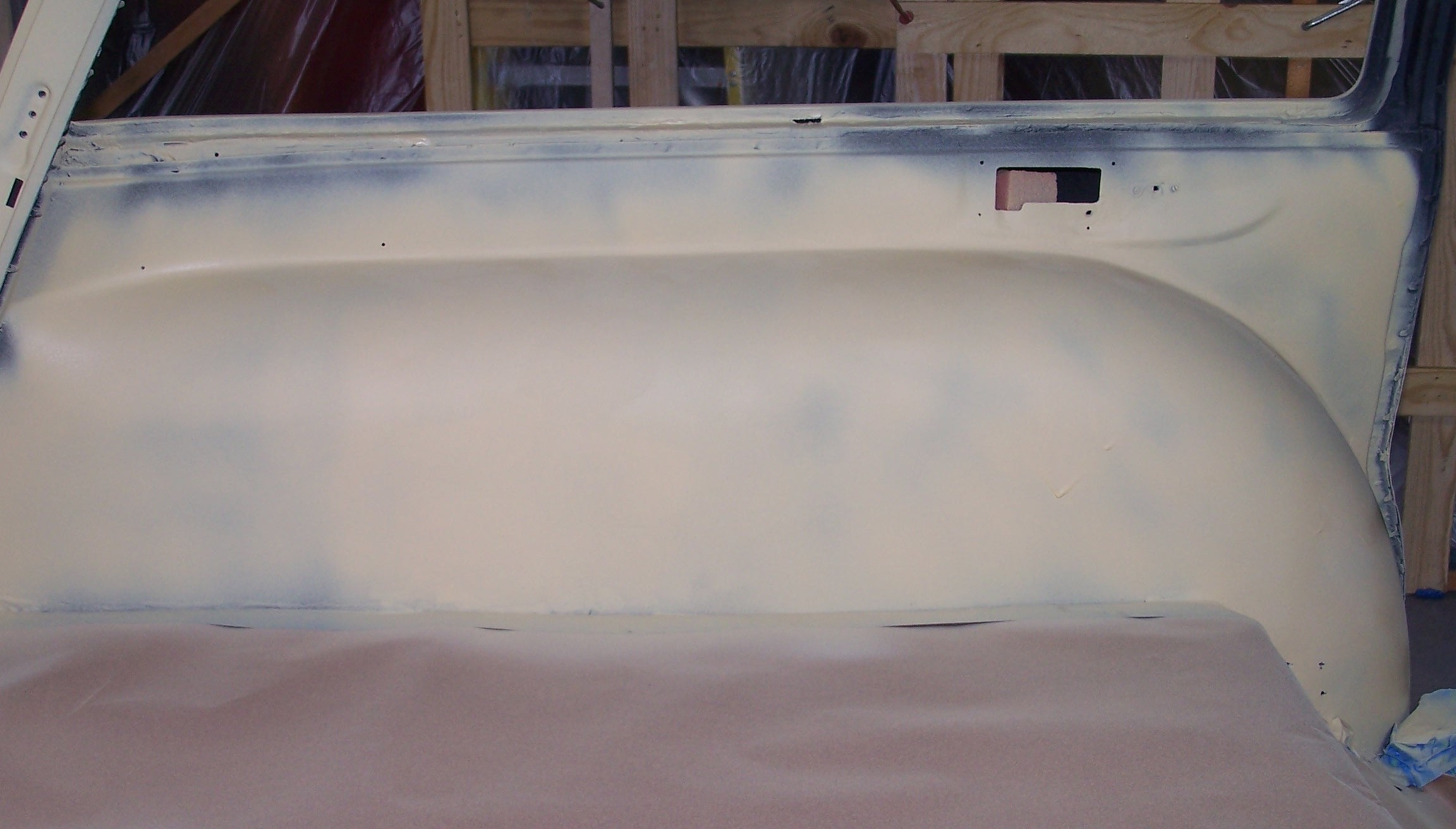 Driver wheelwell in surfacer