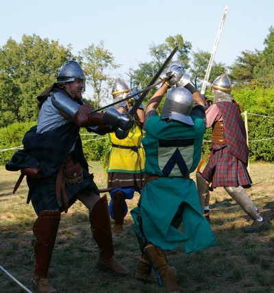 Squire Riochard defends against Angus Frasier's helm attack.