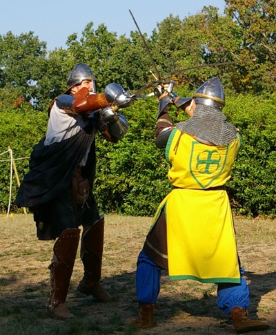 Angus Frasier attempts to hit Squire William's helm, but is blocked.