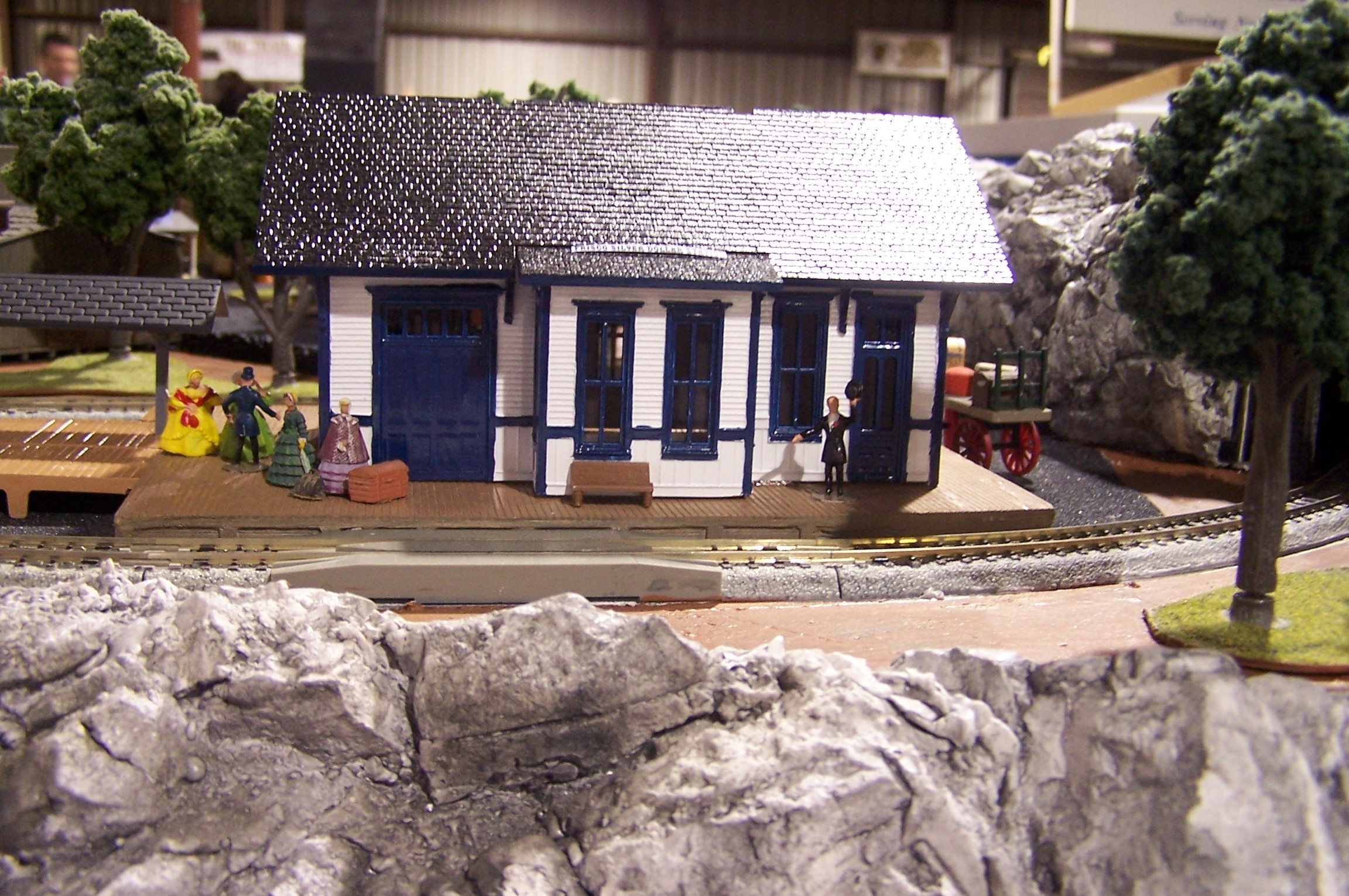 A closeup of the passenger station. Some of the 
          personnel are waiting to board the next train.