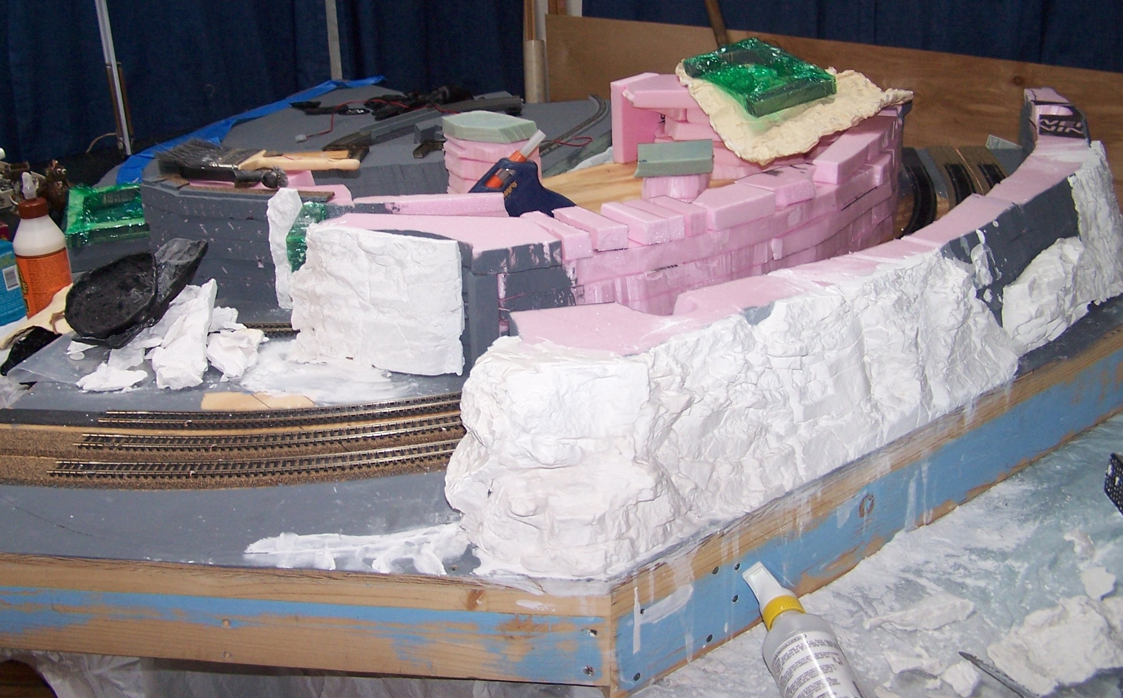 The next step was to cast the mountainside base 
          of the park. The pink foam had to be covered.