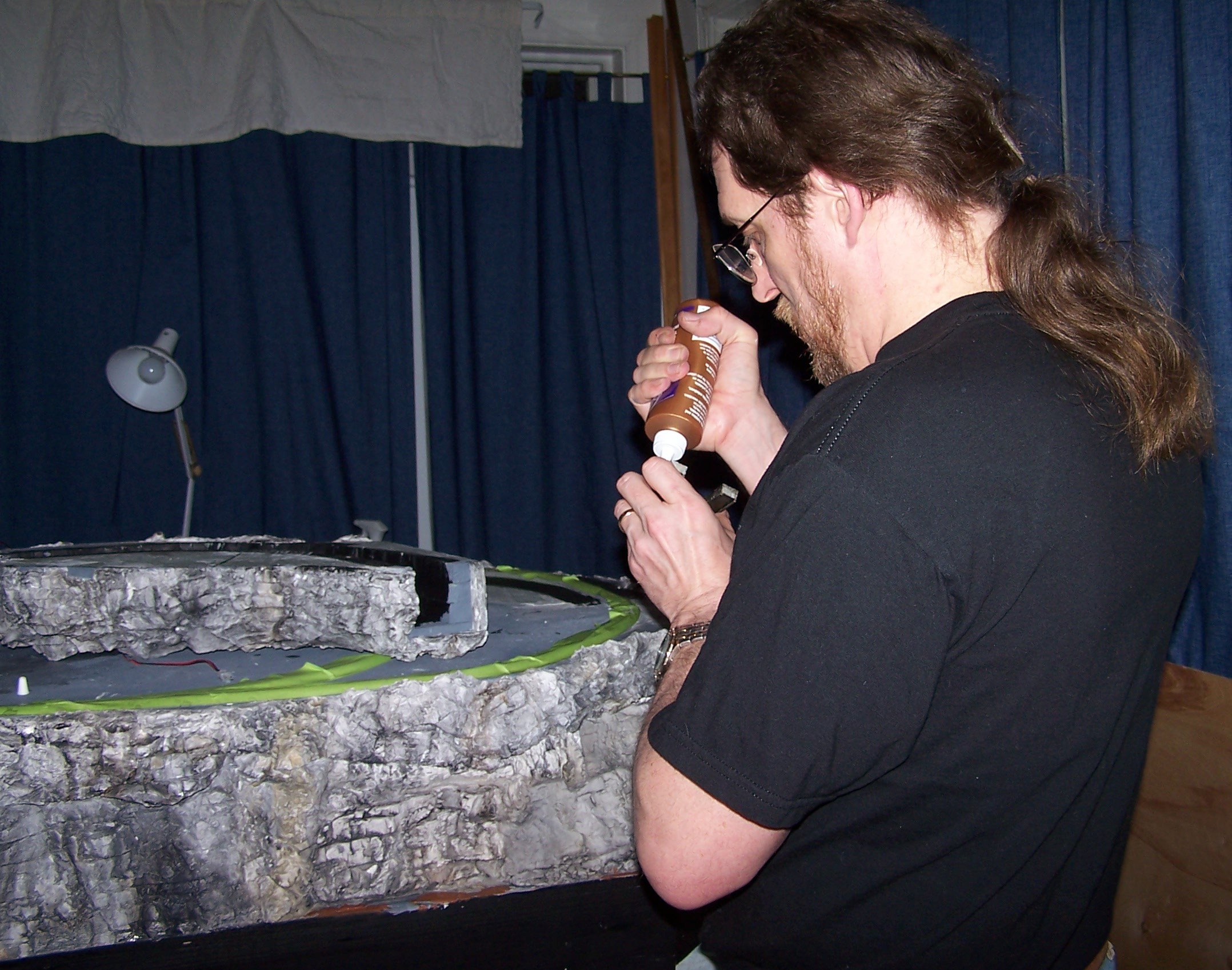 Kurt glued in the tunnel portals for the N scale 
          track after the rocks were colored, but before they were sealed. The 
          portals had to be sealed as well.