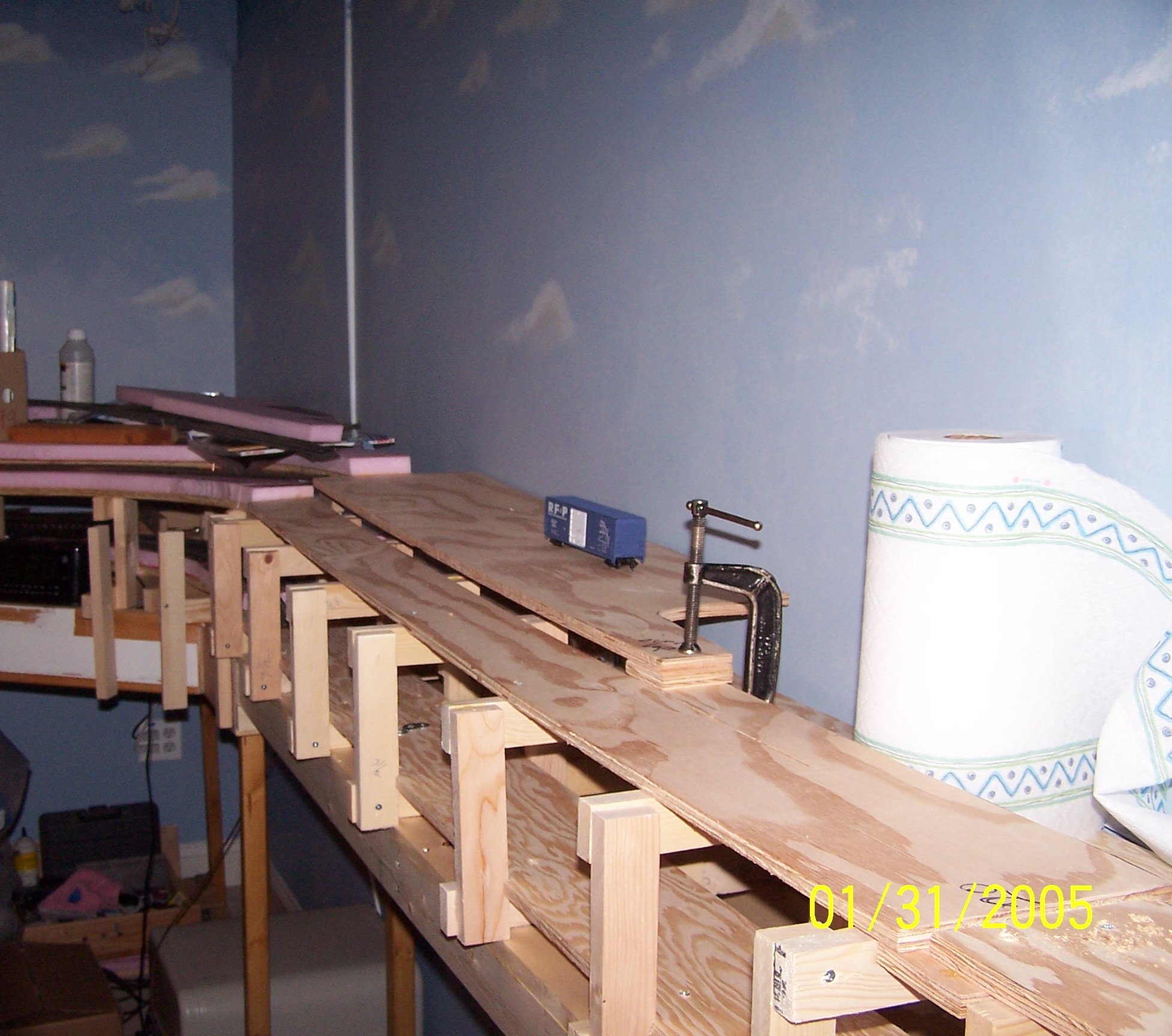 Picture of benchwork behind bed