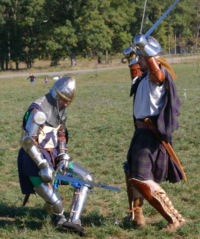 Squire Matthew falls to a double sword blow from Angus Fraser.